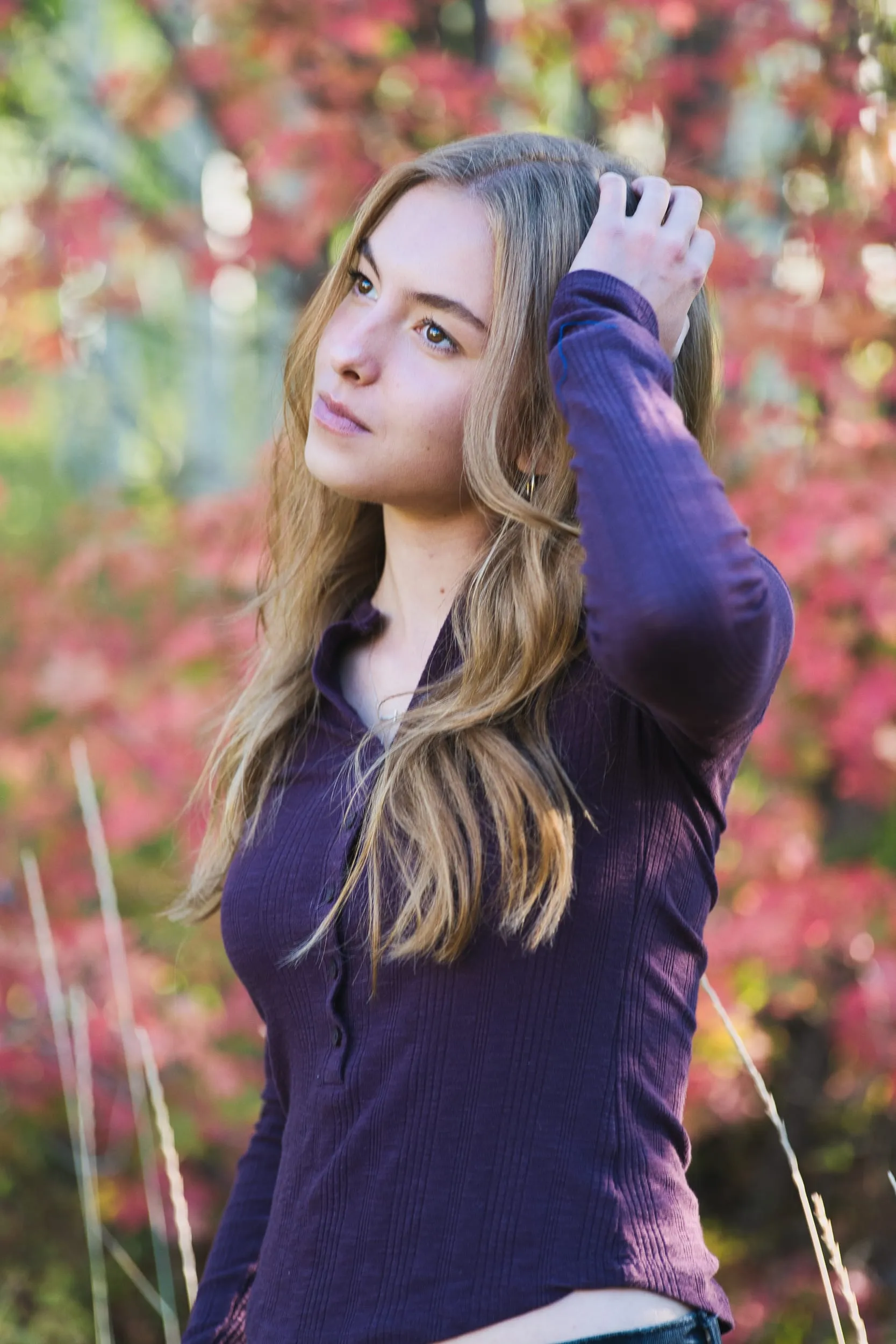 autumn portrait among red foliage