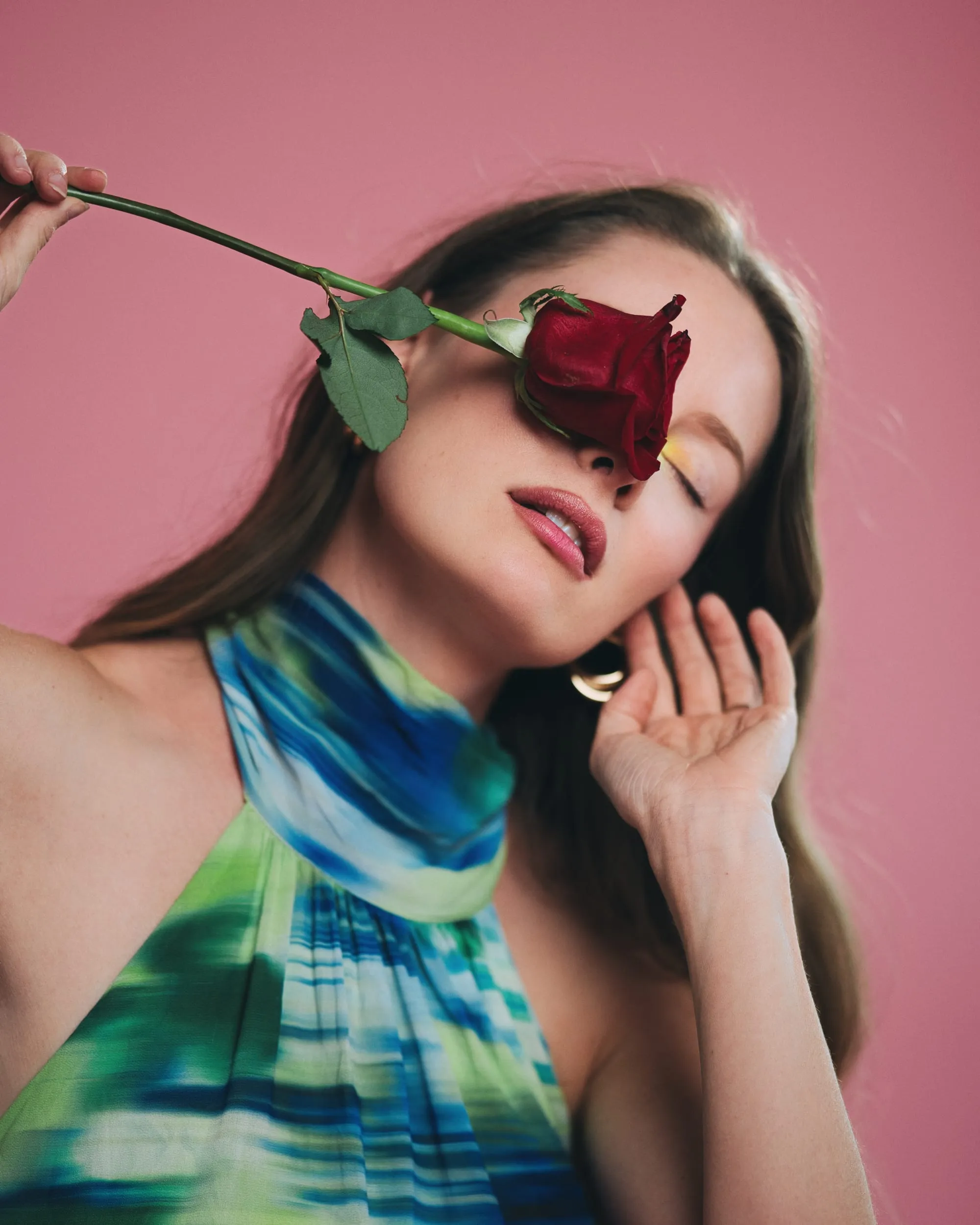 creative portrait red rose pink backdrop