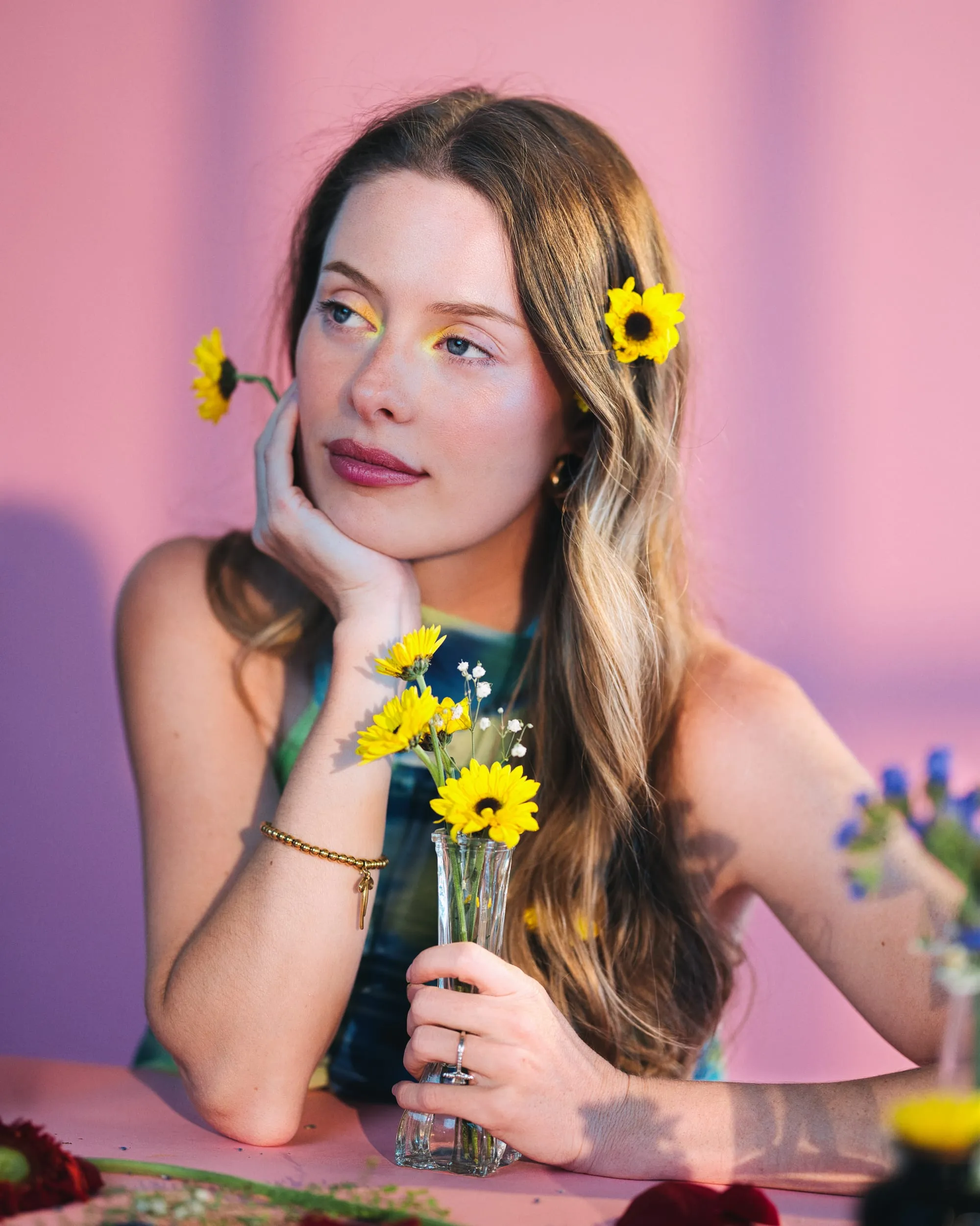 portrait with sunflowers pink backdrop